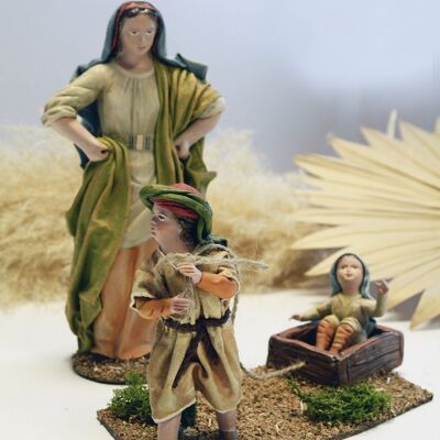 Children pulling box, nativity scene figure