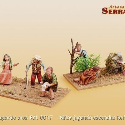 Children playing hide and seek, figures of the nativity scene