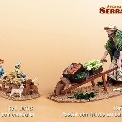 Children playing with wheelbarrow, nativity scene figure