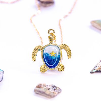 AERWYNA turtle necklace with ocean wave design and sea star