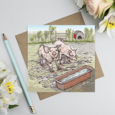 Cartolina d'auguri con maiali nel fango