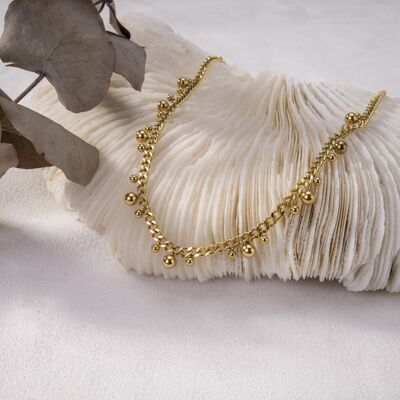 Golden necklace in chain and pendants