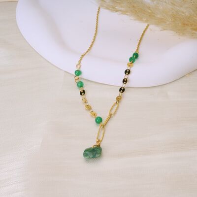 Golden necklace with hanging green stone