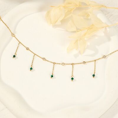 Golden necklace with chains in green pendants