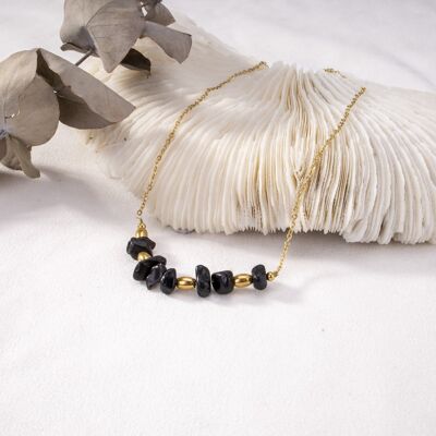 Golden necklace with black pearls and heart pendant