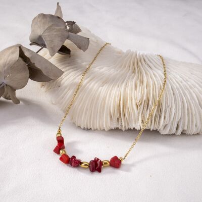 Golden necklace with red beads