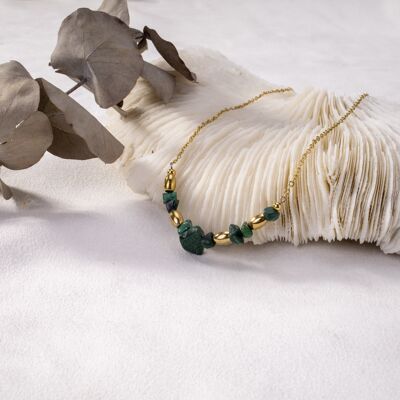 Golden necklace with green pearls