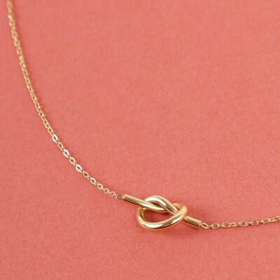 Golden necklace with knot pendant