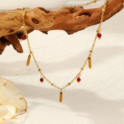 Golden necklace with red pendants
