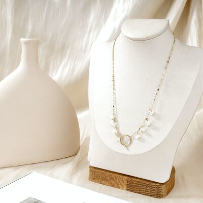 Golden necklace with clasp and white stone