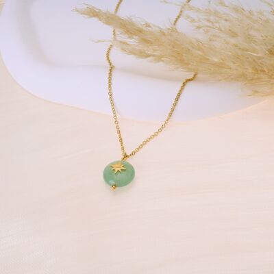 Golden necklace with star pendant and green stone