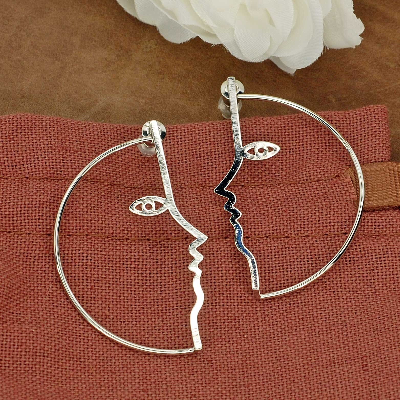 orecchini a forma di viso