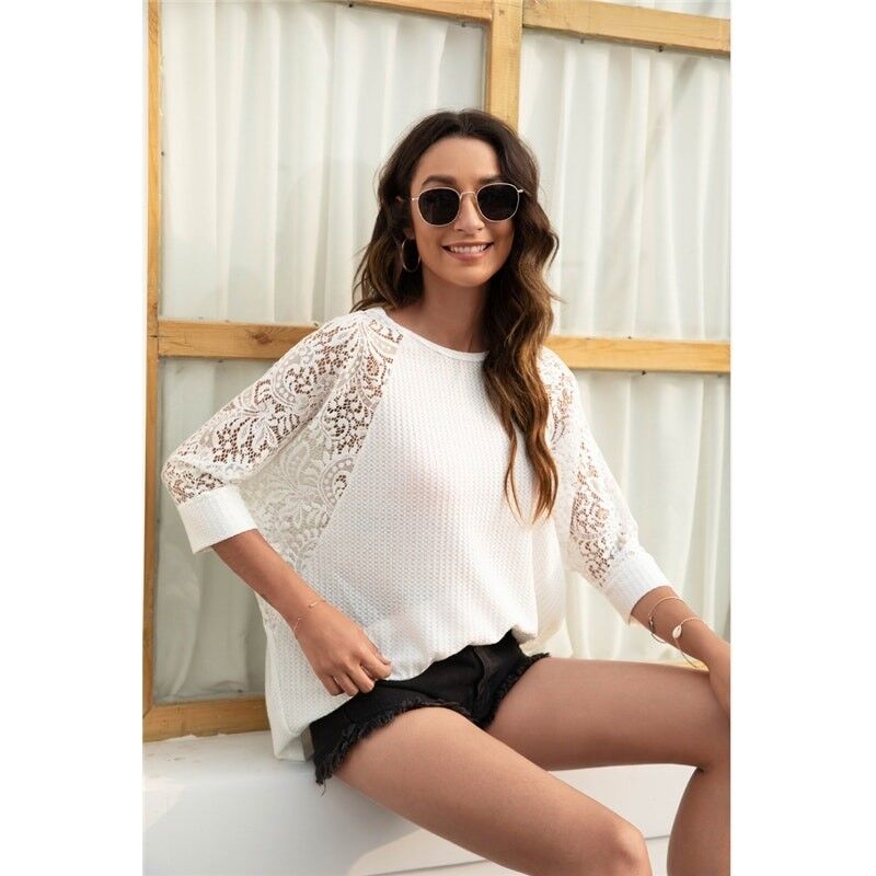 Camiseta hueca sólida con cuello redondo