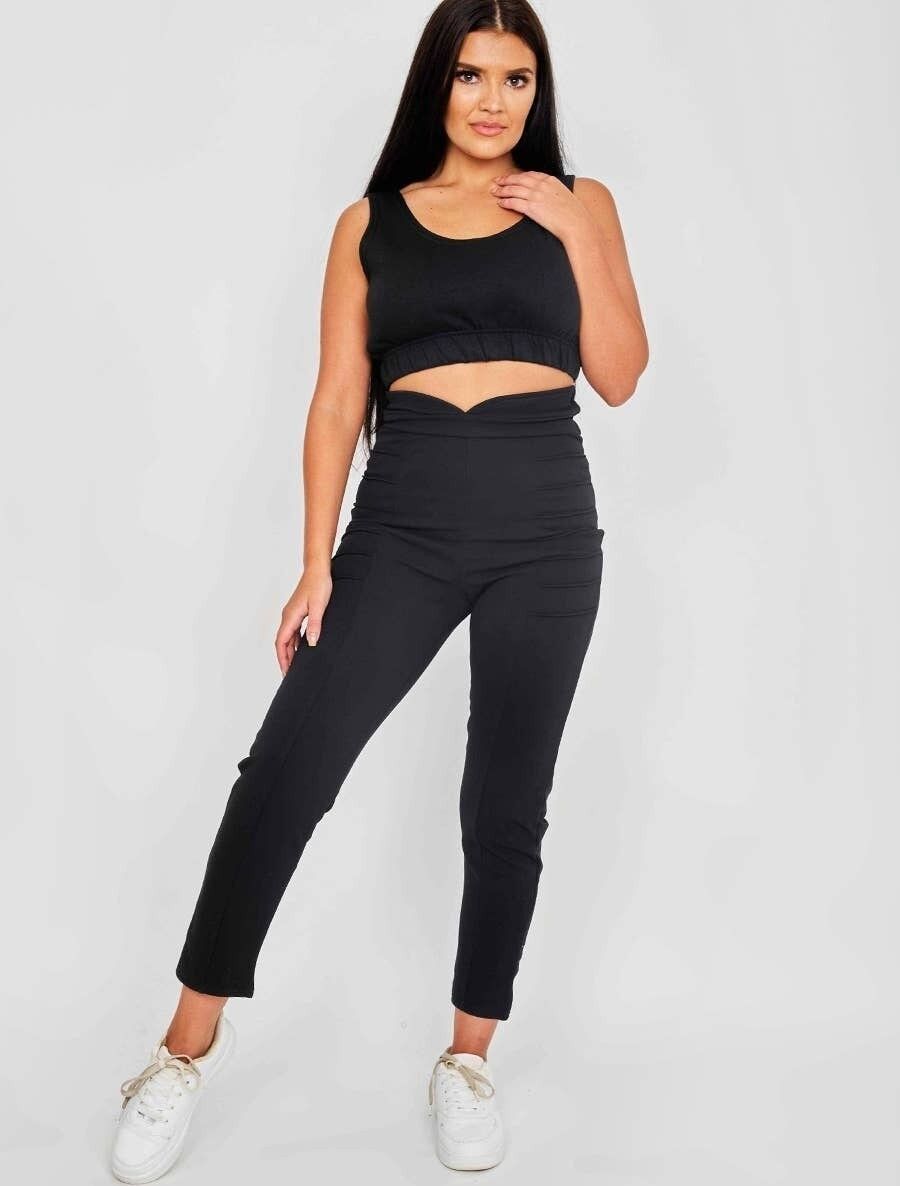 Pantaloni a vita alta con pannello plissettato