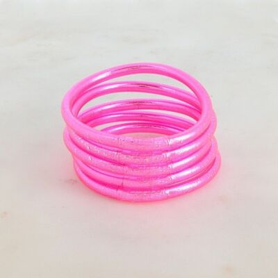 Fluorescent pink thick Buddhist bangle with an engraved mantra "Happiness, Luck, Fortune and Love" in Thai