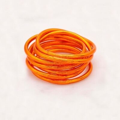 Thick orange Buddhist bangle with an engraved mantra "Happiness, Luck, Fortune and Love" in Thai