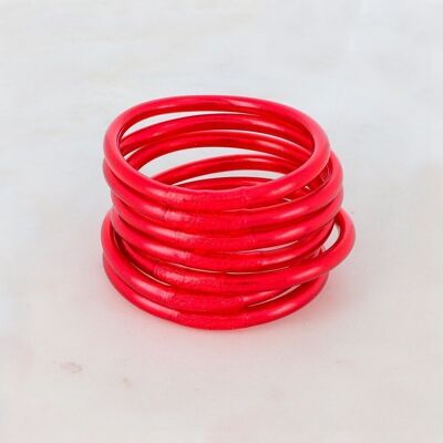 Bright red thick Buddhist bangle with an engraved mantra "Happiness, Luck, Fortune and Love" in Thai