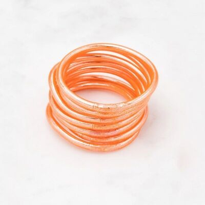 Thick salmon Buddhist bangle with an engraved mantra "Happiness, Luck, Fortune and Love" in Thai