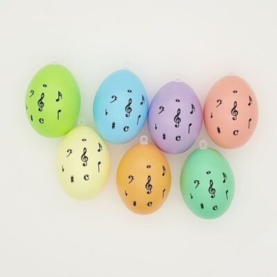 Decoration easter eggs with treble clef and notes, different colors - pastel
