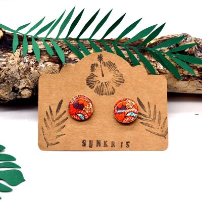 Small round wooden earrings and blue orange colored wax paper