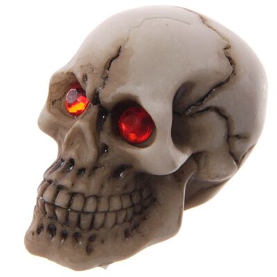 Crâne horrible avec décoration yeux gemme rouge