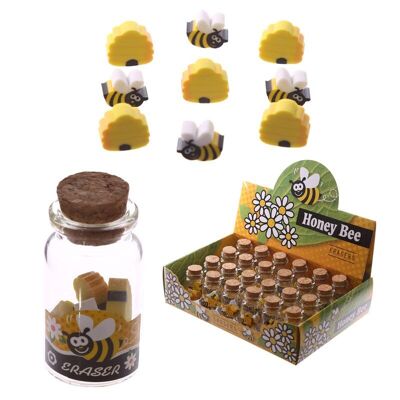Lindas mini gomas de borrar en un tarro de abejas de miel