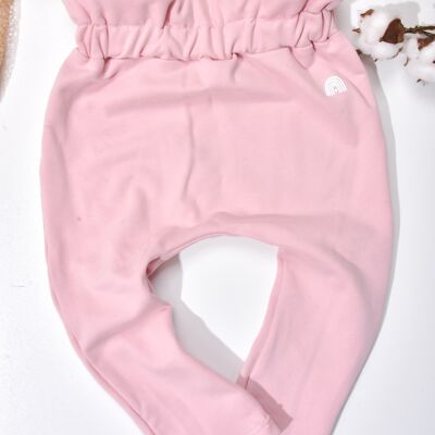 Pantaloni rosa per neonata in sacchetto di carta organica