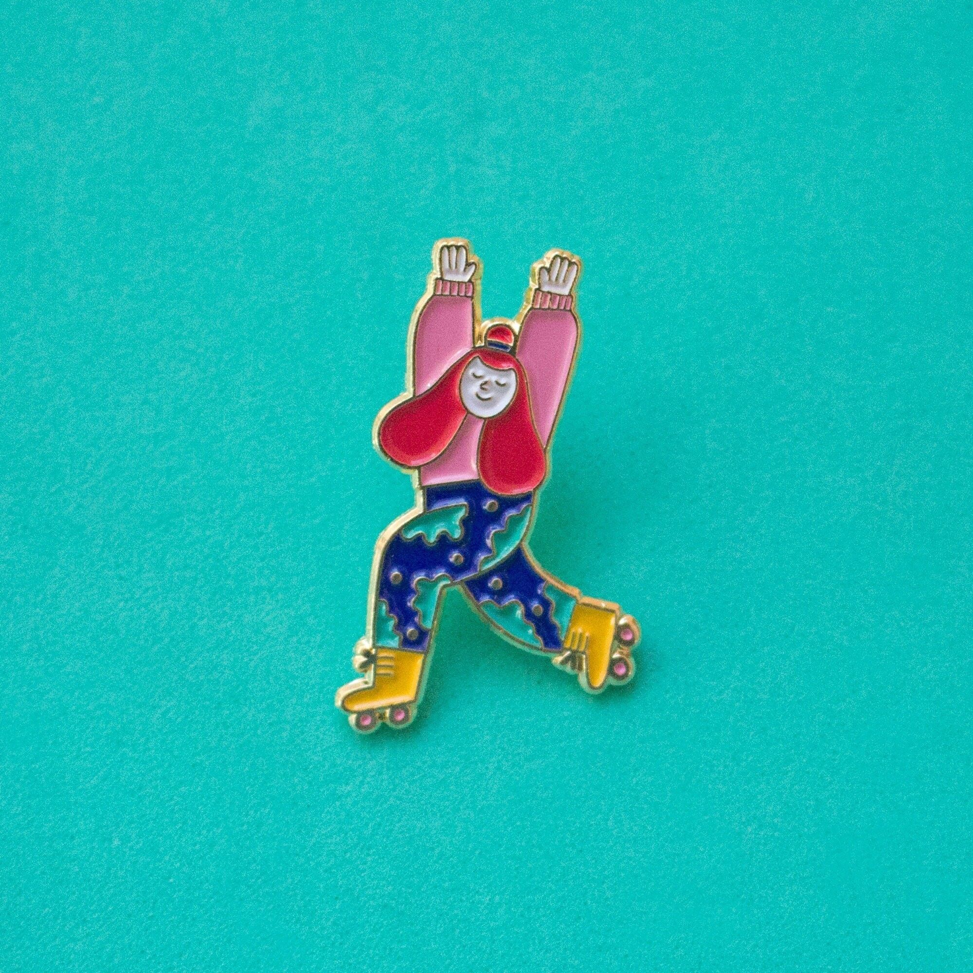 Spilla da pattinatore a rotelle