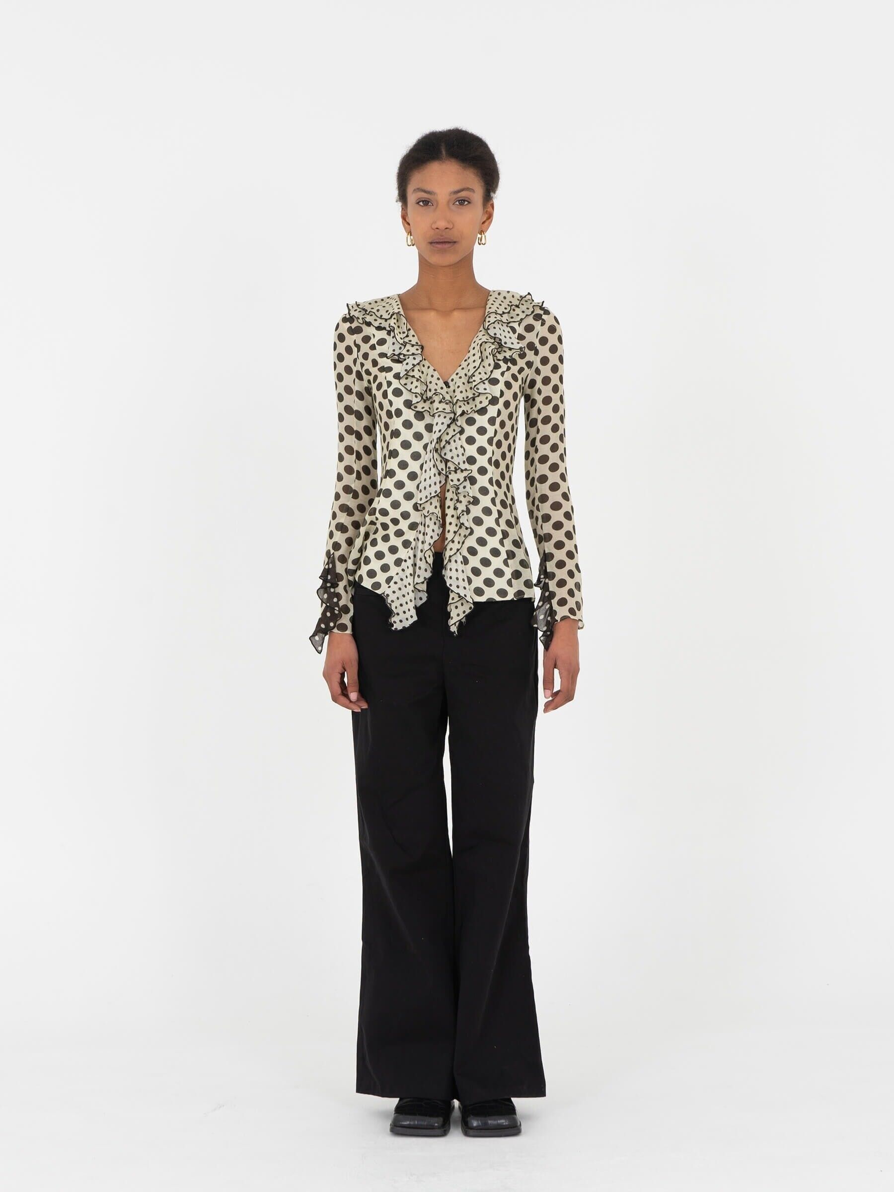 Blusa a maniche lunghe con volant a pois