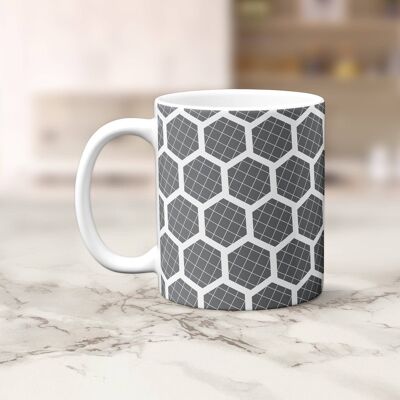 Tasse, tasse à thé ou à café grise avec motif hexagone blanc