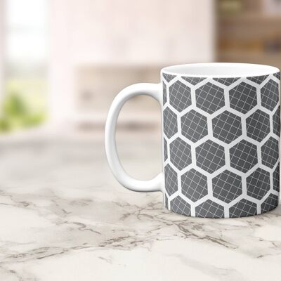 Tasse, tasse à thé ou à café grise avec motif hexagone blanc