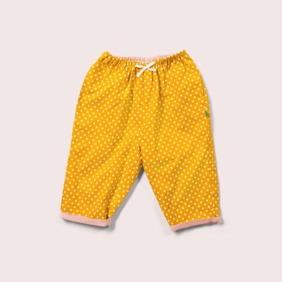 Pantalones sueltos reversibles con flores doradas