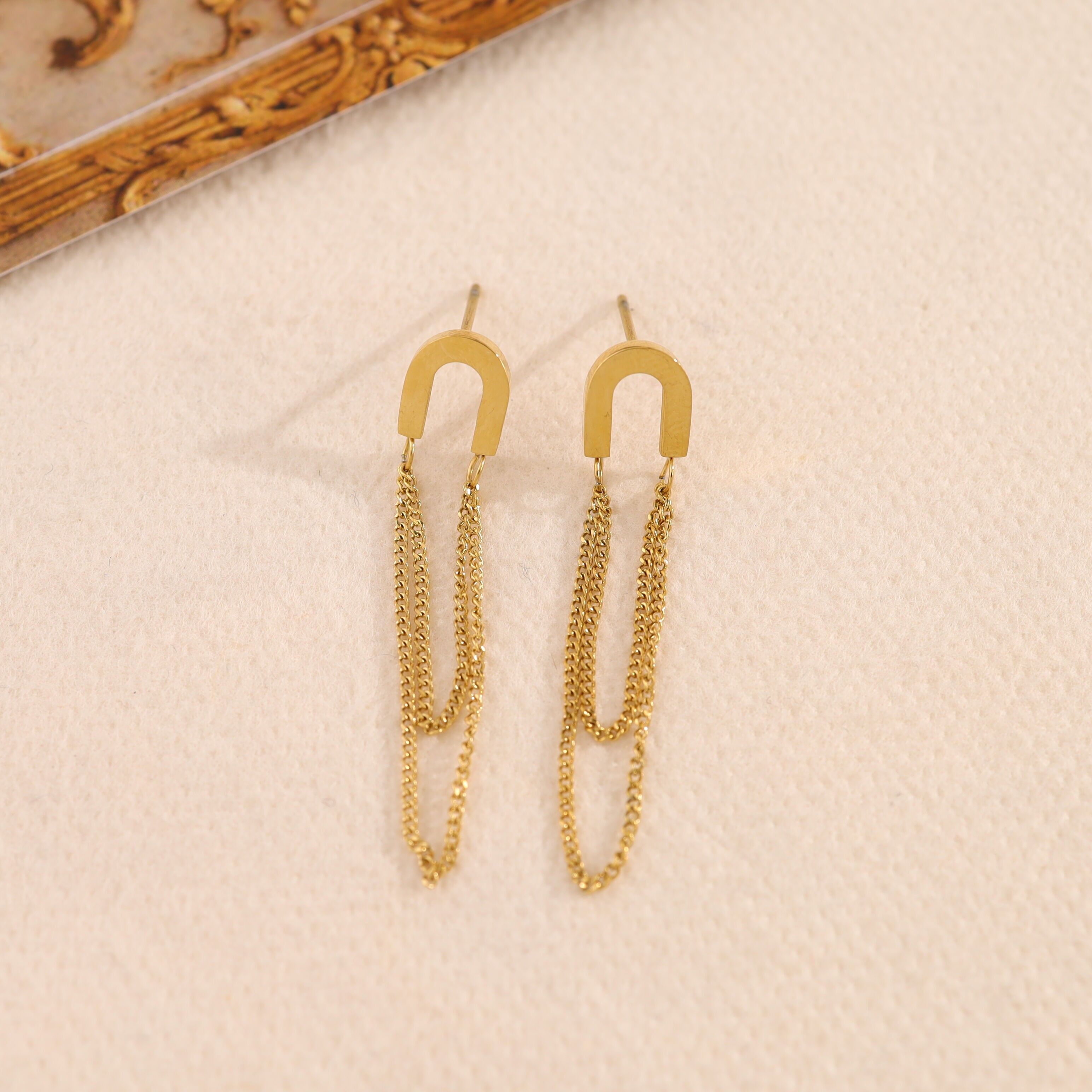 Orecchini con doppia catena