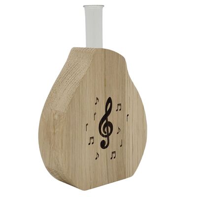Noble wooden vase including glass cylinder with treble clef and sheet music