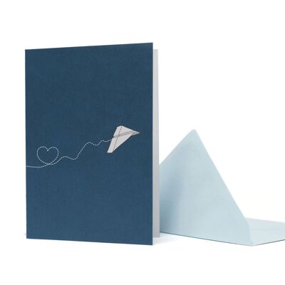 Greeting card paper airplane with heart