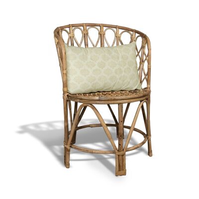 ARMCHAIR IN NATURAL RATTAN BRAIDED BY HAND WITH A BRICK AND CAMEL COLOR CUSHION WITH PATTERNS AND POMPOMS