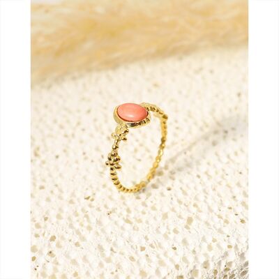 Golden ring with pink stone