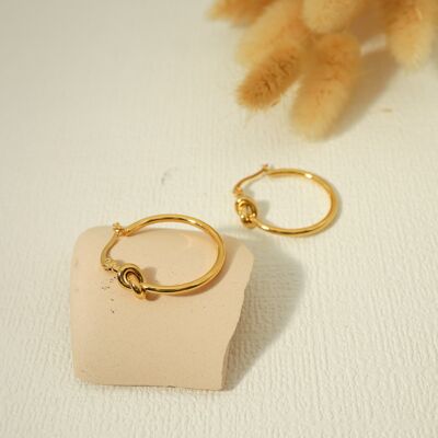 Golden hoop earrings with bow