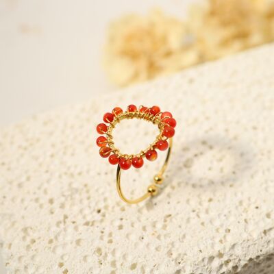 Golden circle ring with red pearls