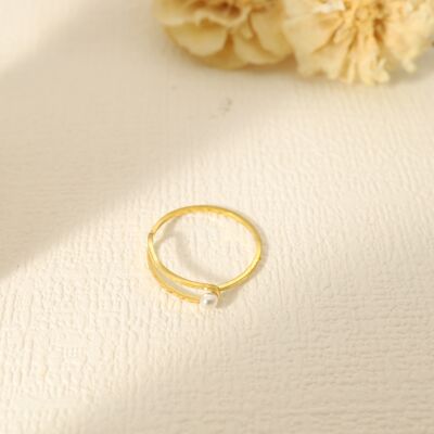 Golden double line ring with a pearl