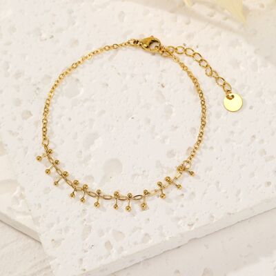 Pulsera dorada con detalles