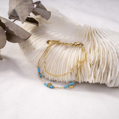 Bracelet doré double chaîne avec perles bleues