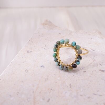 Golden circle ring with green beads