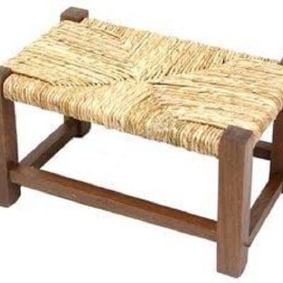 Low wooden footrest stool with straw