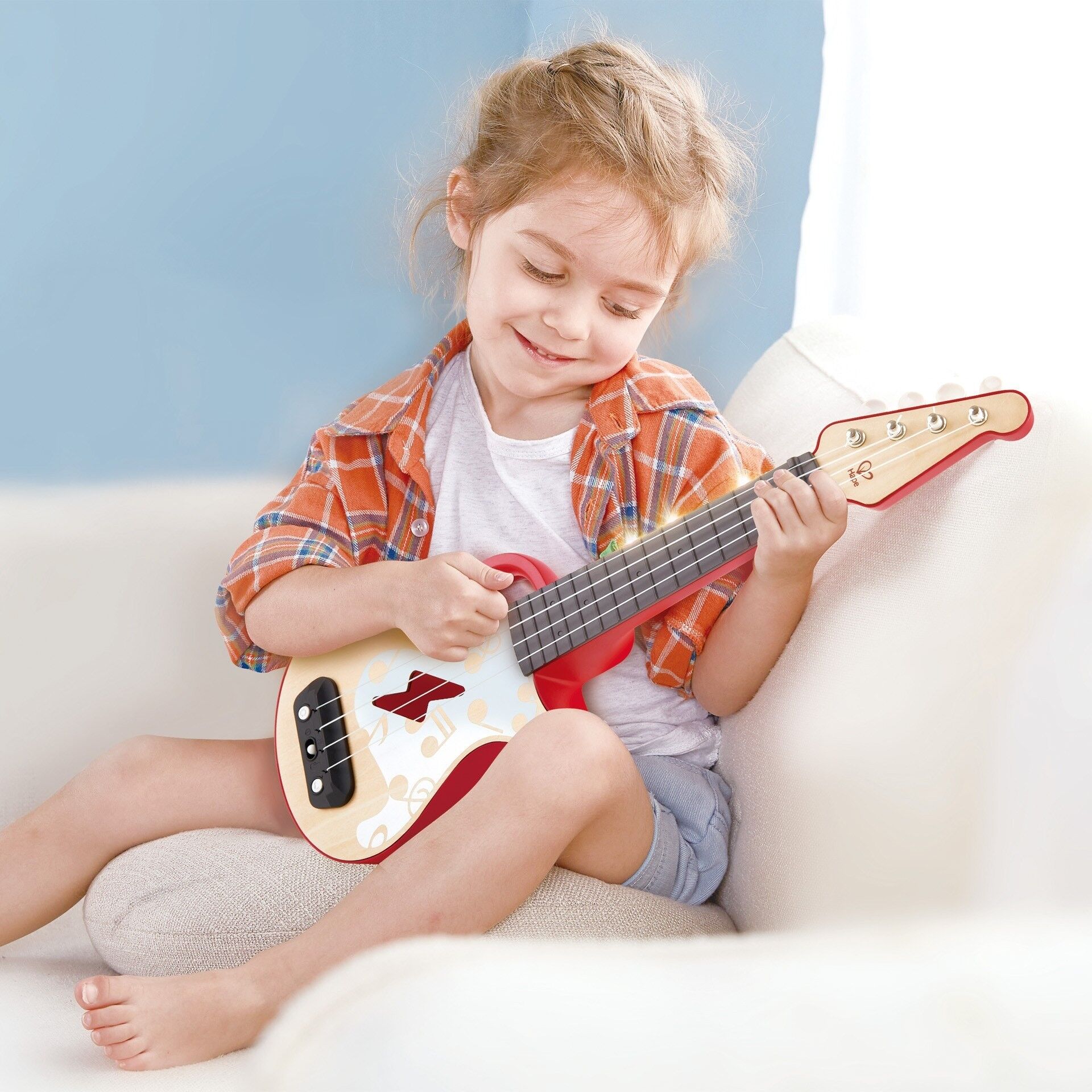 Hape - Juguete de madera - Ukelele eléctrico con aprendizaje interactivo Rojo