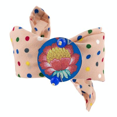 Celebrate spring with floral-inspired accessories. The Circle Fabric Bracelet Small Pink Flower Blue Background Made in Italy