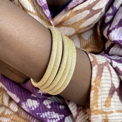 Golden bracelet, a shiny golden fabric bangle