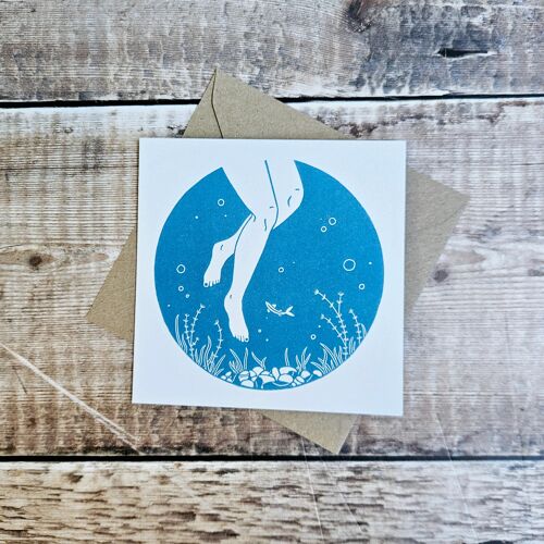Below - Blank greeting card featuring a pair of legs under the water