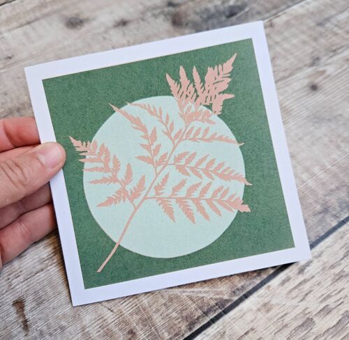 Fern - Blank greeting card with a fern in front a pale green circle