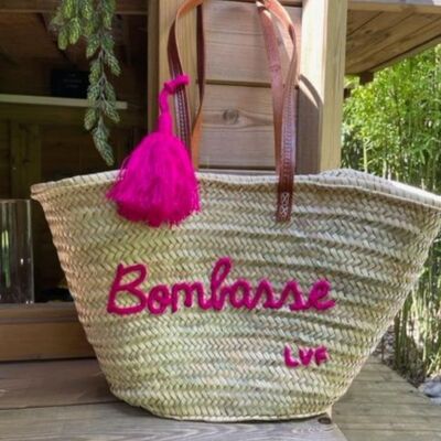 "Bombasse" straw basket with long fushia pompom